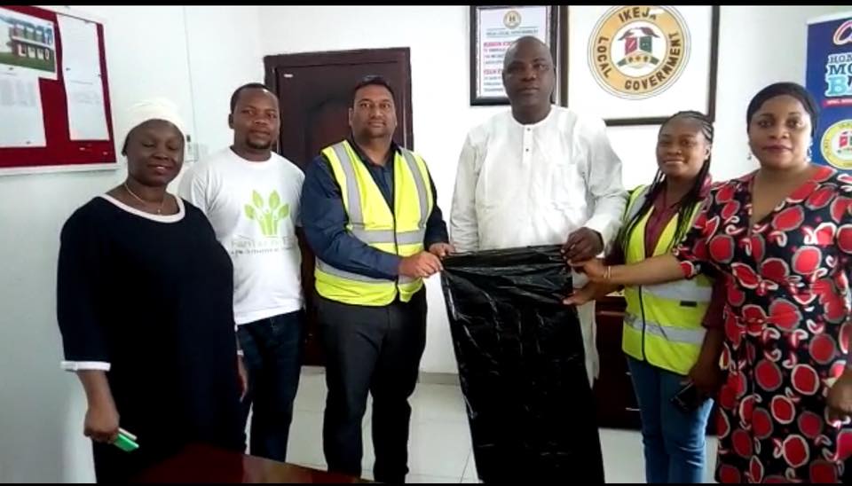 Distributing biodegradable liners to LAWMA (Lagos Waste Management Authority) team in Lagos, Nigeria